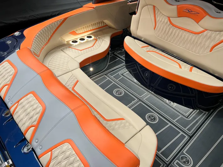 Thunder Struck Yacht Photos Pics Luxurious interior of 2024 MTI V42 boat with orange and beige seating.