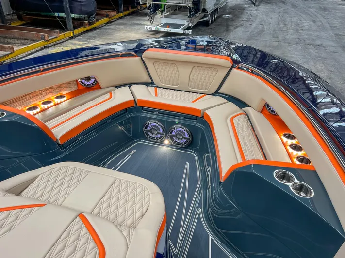 Thunder Struck Yacht Photos Pics Luxurious interior of 2024 MTI V42 boat with elegant seating and ambient lighting.