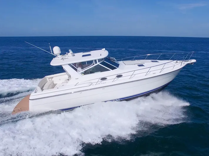 Ohana Yacht Photos Pics 2003 Tiara Yachts 4000 Express cruising on open water.