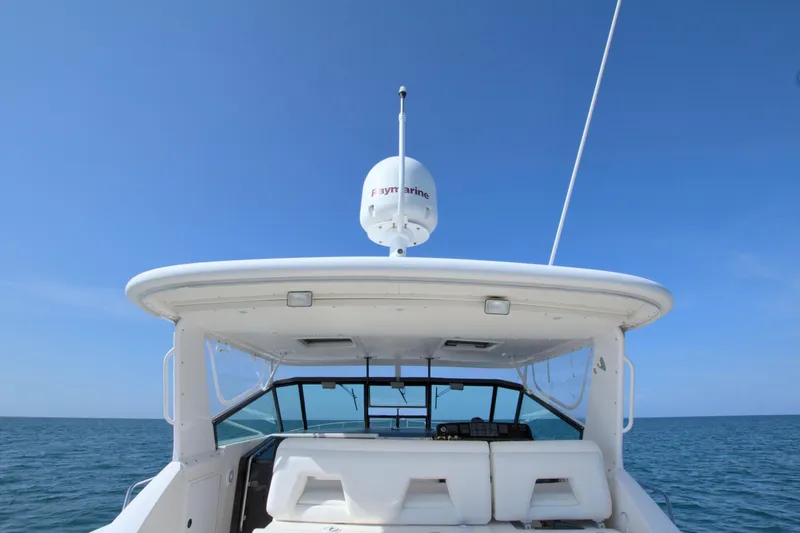 Ohana Yacht Photos Pics Tiara Yachts 4000 Express 2003, rear view on open sea under clear blue sky.