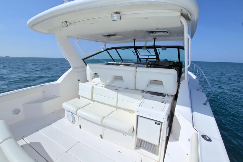 Ohana Yacht Photos Pics 2003 Tiara Yachts 4000 Express, spacious deck with seating, cruising on open water.