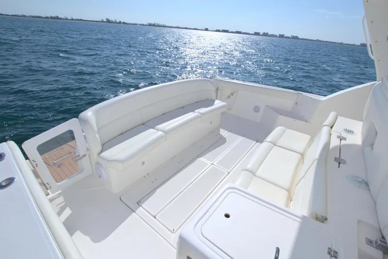 Ohana Yacht Photos Pics 2003 Tiara Yachts 4000 Express, spacious deck with white seating, ocean view.