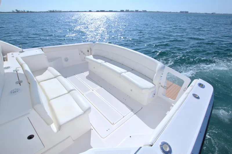 Ohana Yacht Photos Pics 2003 Tiara Yachts 4000 Express boat deck with white seating, overlooking the ocean.
