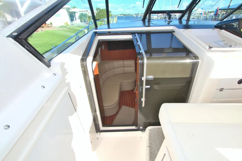 Ohana Yacht Photos Pics 2003 Tiara Yachts 4000 Express interior view with seating and cabin entrance.