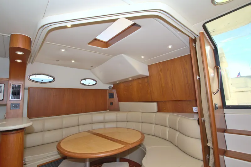 Ohana Yacht Photos Pics 2003 Tiara Yachts 4000 Express interior with elegant wood finish and plush seating.