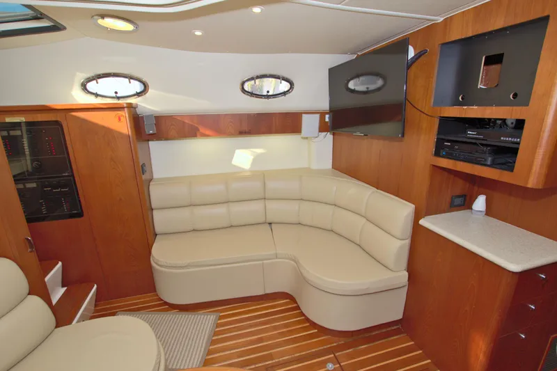 Ohana Yacht Photos Pics Luxurious interior of 2003 Tiara Yachts 4000 Express with leather seating and wood accents.