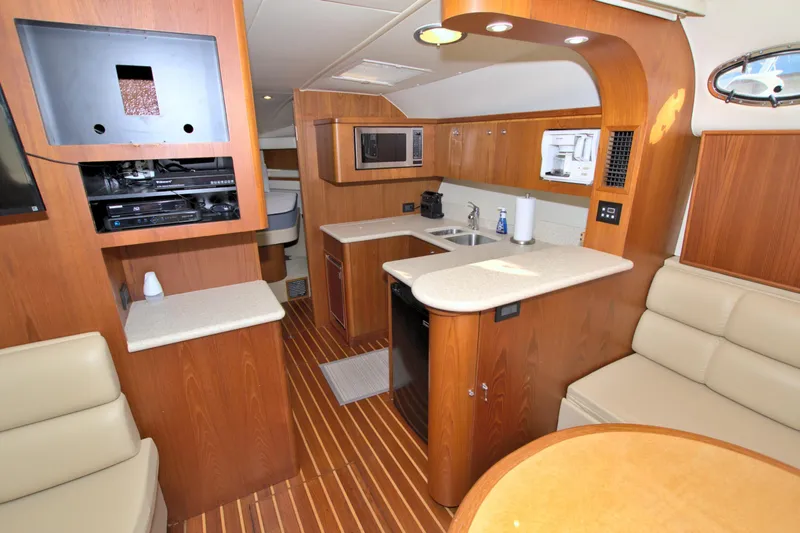Ohana Yacht Photos Pics 2003 Tiara Yachts 4000 Express interior with wood finish and modern amenities.