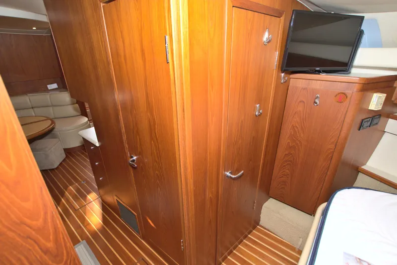 Ohana Yacht Photos Pics Interior of 2003 Tiara Yachts 4000 Express with wood paneling and modern amenities.