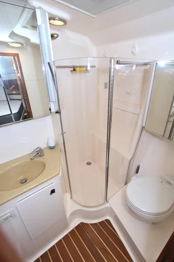 Ohana Yacht Photos Pics 2003 Tiara Yachts 4000 Express bathroom with shower, sink, and toilet.