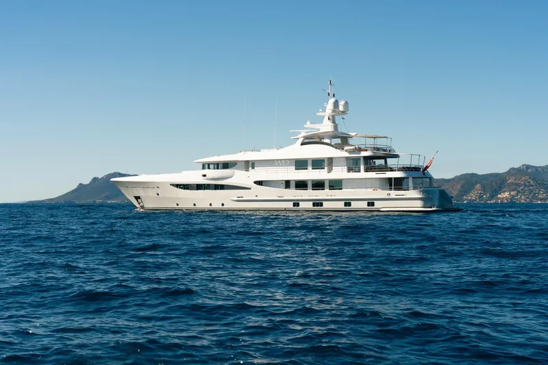 Were Dreams Yacht Photos Pics Luxurious 2008 Amels 171 Limited Edition yacht cruising on open sea with scenic coastline.