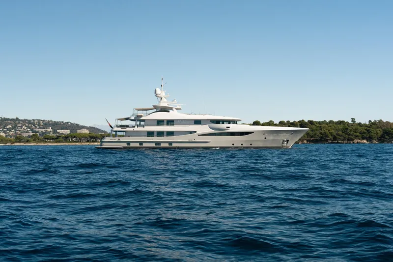 Were Dreams Yacht Photos Pics Luxury yacht Amels 171 Limited Edition 2008 on open sea, clear sky background.