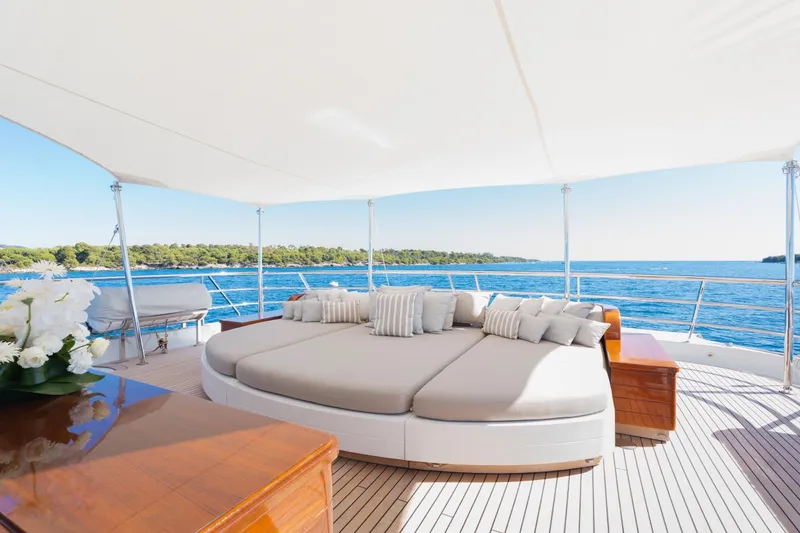 Were Dreams Yacht Photos Pics Luxurious deck of 2008 Amels 171 Limited Edition yacht with elegant seating and ocean view.