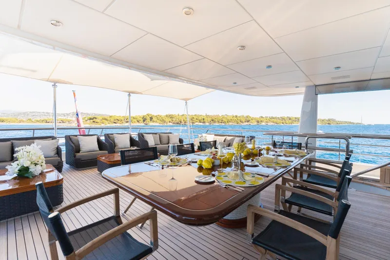 Were Dreams Yacht Photos Pics Luxurious dining area on 2008 Amels 171 Limited Edition yacht, overlooking serene ocean views.