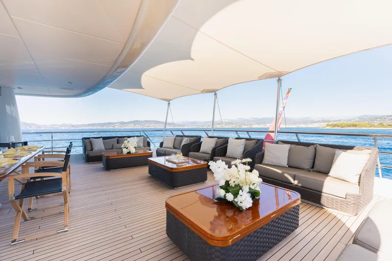 Were Dreams Yacht Photos Pics Luxurious deck of 2008 Amels 171 Limited Edition yacht with elegant seating and ocean view.
