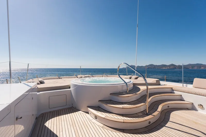 Were Dreams Yacht Photos Pics Luxurious Amels 171 yacht deck with jacuzzi, ocean view, and sun loungers, 2008 model.