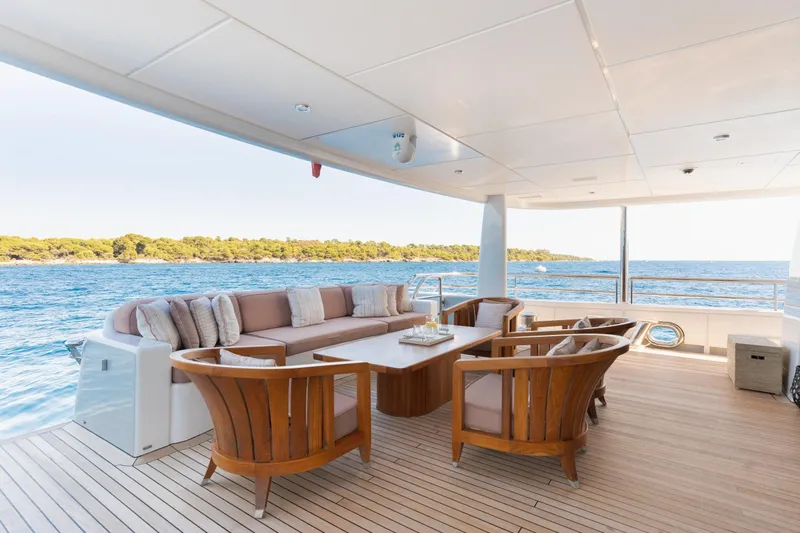 Were Dreams Yacht Photos Pics Luxurious deck of 2008 Amels 171 Limited Edition yacht with elegant seating and ocean view.