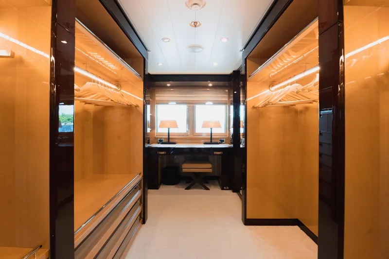 Were Dreams Yacht Photos Pics Luxurious walk-in closet on 2008 Amels 171 Limited Edition yacht, featuring elegant wood finishes.