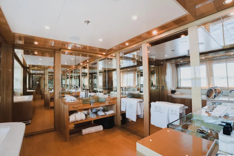 Were Dreams Yacht Photos Pics Luxurious bathroom interior on 2008 Amels 171 Limited Edition yacht, featuring elegant wood and mirrors.
