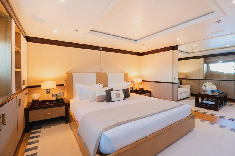 Were Dreams Yacht Photos Pics Luxurious bedroom interior on 2008 Amels 171 Limited Edition yacht, featuring elegant decor and cozy ambiance.