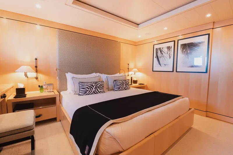 Were Dreams Yacht Photos Pics Luxurious bedroom interior on 2008 Amels 171 Limited Edition yacht, featuring elegant decor and cozy lighting.