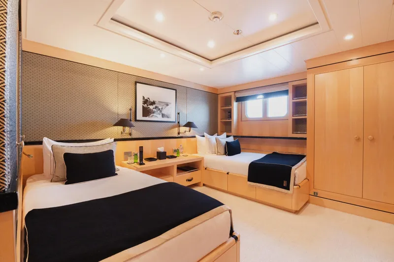 Were Dreams Yacht Photos Pics Luxurious cabin interior of 2008 Amels 171 Limited Edition yacht, featuring twin beds and elegant decor.