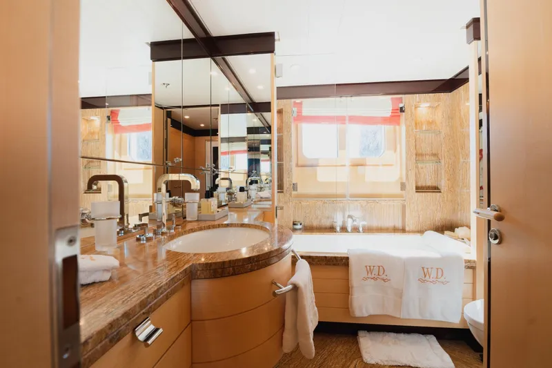 Were Dreams Yacht Photos Pics Luxurious bathroom on 2008 Amels 171 Limited Edition yacht with elegant fixtures and decor.