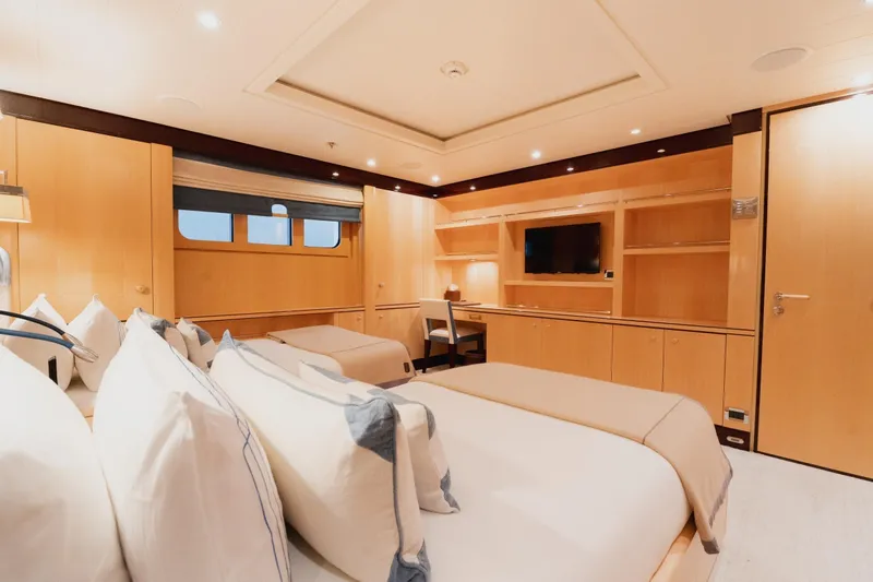 Were Dreams Yacht Photos Pics Luxurious cabin interior of 2008 Amels 171 Limited Edition yacht, featuring elegant wood finishes.