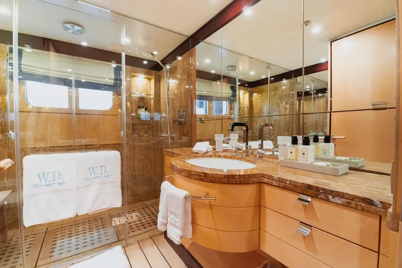 Were Dreams Yacht Photos Pics Luxurious bathroom on 2008 Amels 171 Limited Edition yacht with elegant wood and marble finishes.