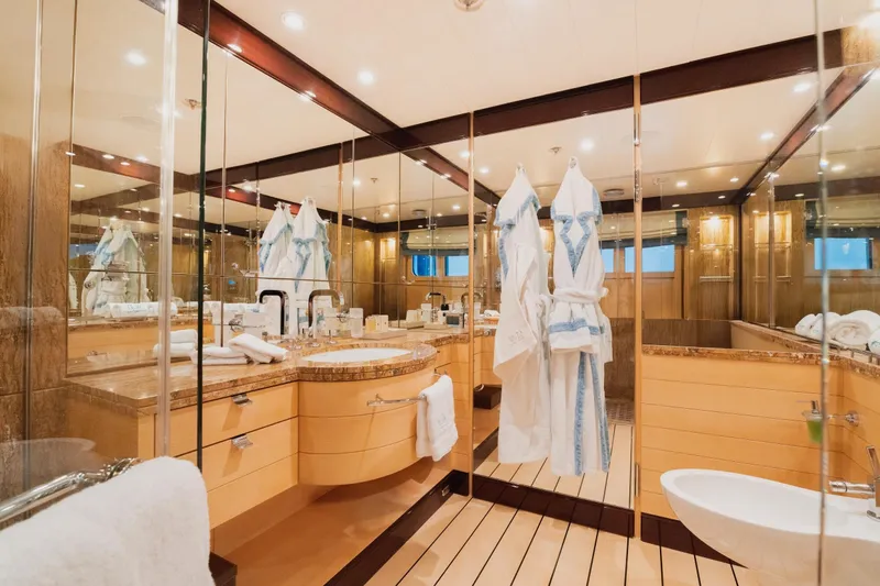 Were Dreams Yacht Photos Pics Luxurious bathroom on 2008 Amels 171 Limited Edition yacht, featuring elegant design and amenities.