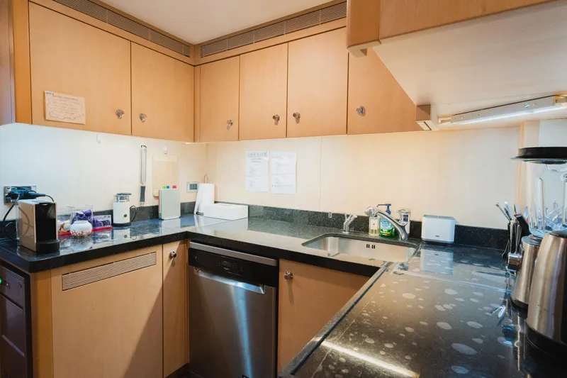 Were Dreams Yacht Photos Pics Modern kitchen in 2008 Amels 171 Limited Edition yacht with sleek countertops and appliances.