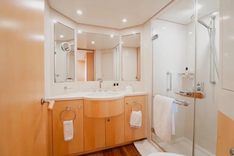 Were Dreams Yacht Photos Pics Luxurious bathroom on 2008 Amels 171 Limited Edition yacht, featuring modern fixtures and elegant design.