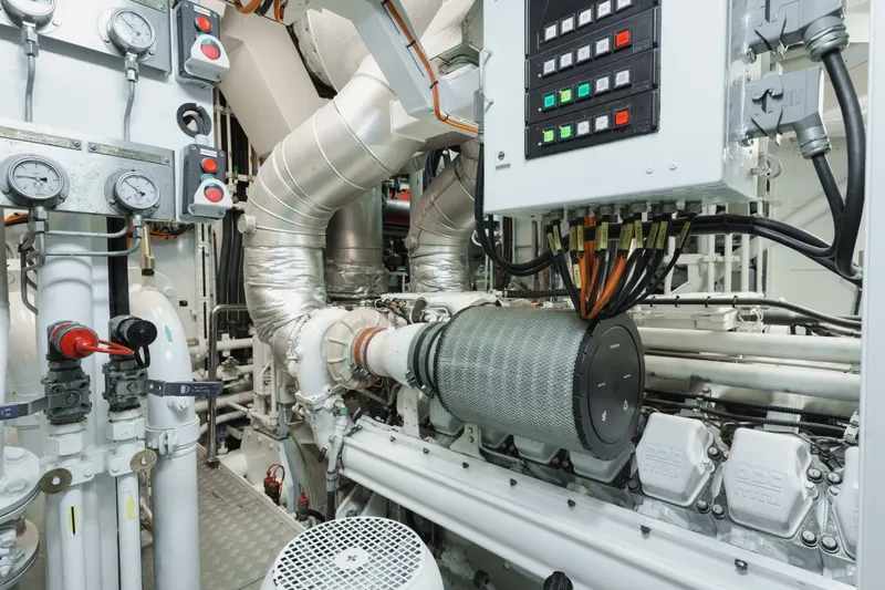 Were Dreams Yacht Photos Pics Engine room of 2008 Amels 171 Limited Edition yacht, featuring gauges and control panels.