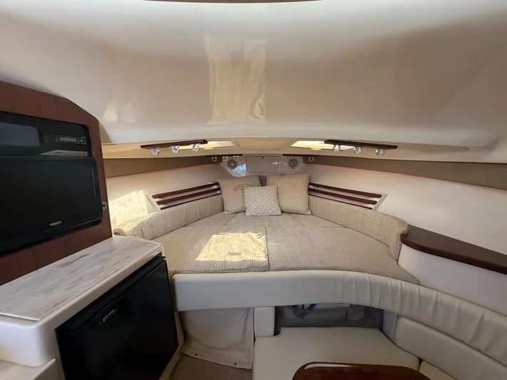  Yacht Photos Pics 2016 Grady-White Express 330 cabin interior with cozy bed and modern amenities.