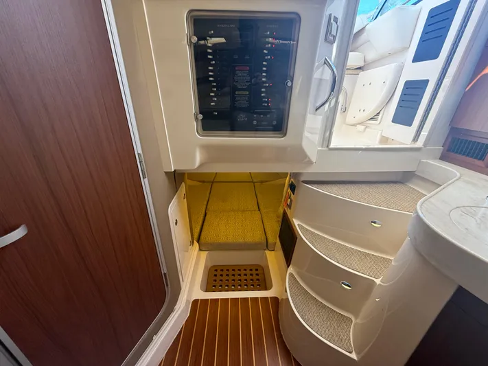  Yacht Photos Pics Interior of 2016 Grady-White Express 330 boat with control panel and stairs.