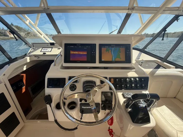  Yacht Photos Pics 2016 Grady-White Express 330 helm with dual navigation screens and steering wheel.