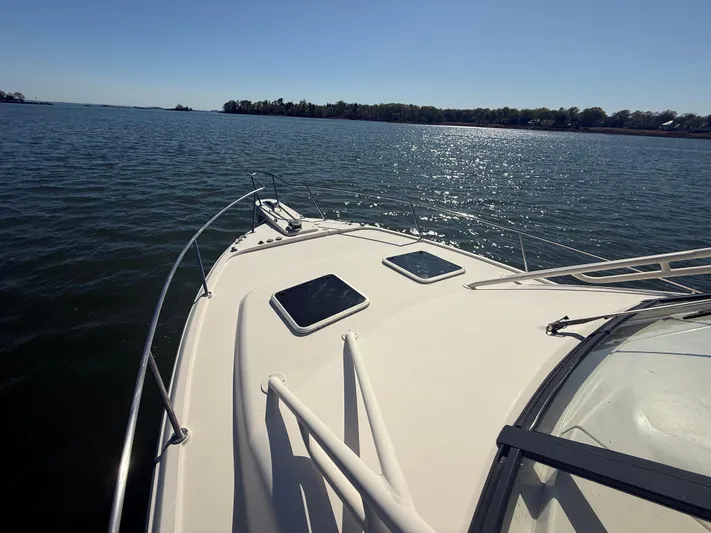  Yacht Photos Pics 2016 Grady-White Express 330 boat on calm water, sunny day, scenic view.