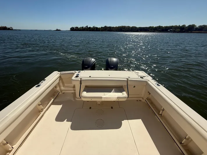  Yacht Photos Pics 2016 Grady-White Express 330 boat deck with twin engines on a sunny day.