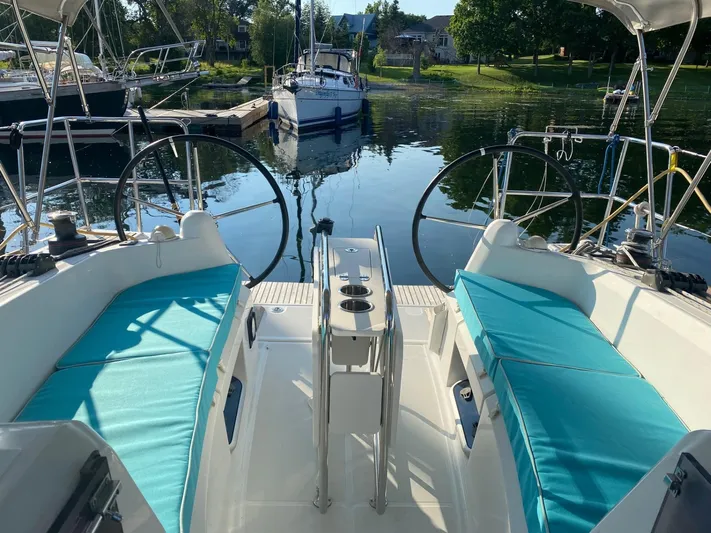  Yacht Photos Pics Jeanneau Sun Odyssey 349 sailboat cockpit, 2017 model, featuring turquoise cushions.