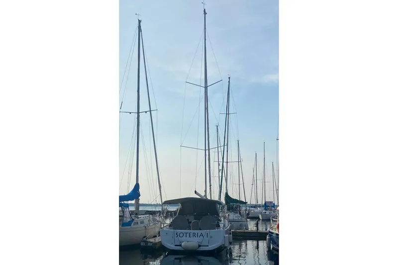  Yacht Photos Pics 2017 Jeanneau Sun Odyssey 349 sailboat docked at marina under clear sky.