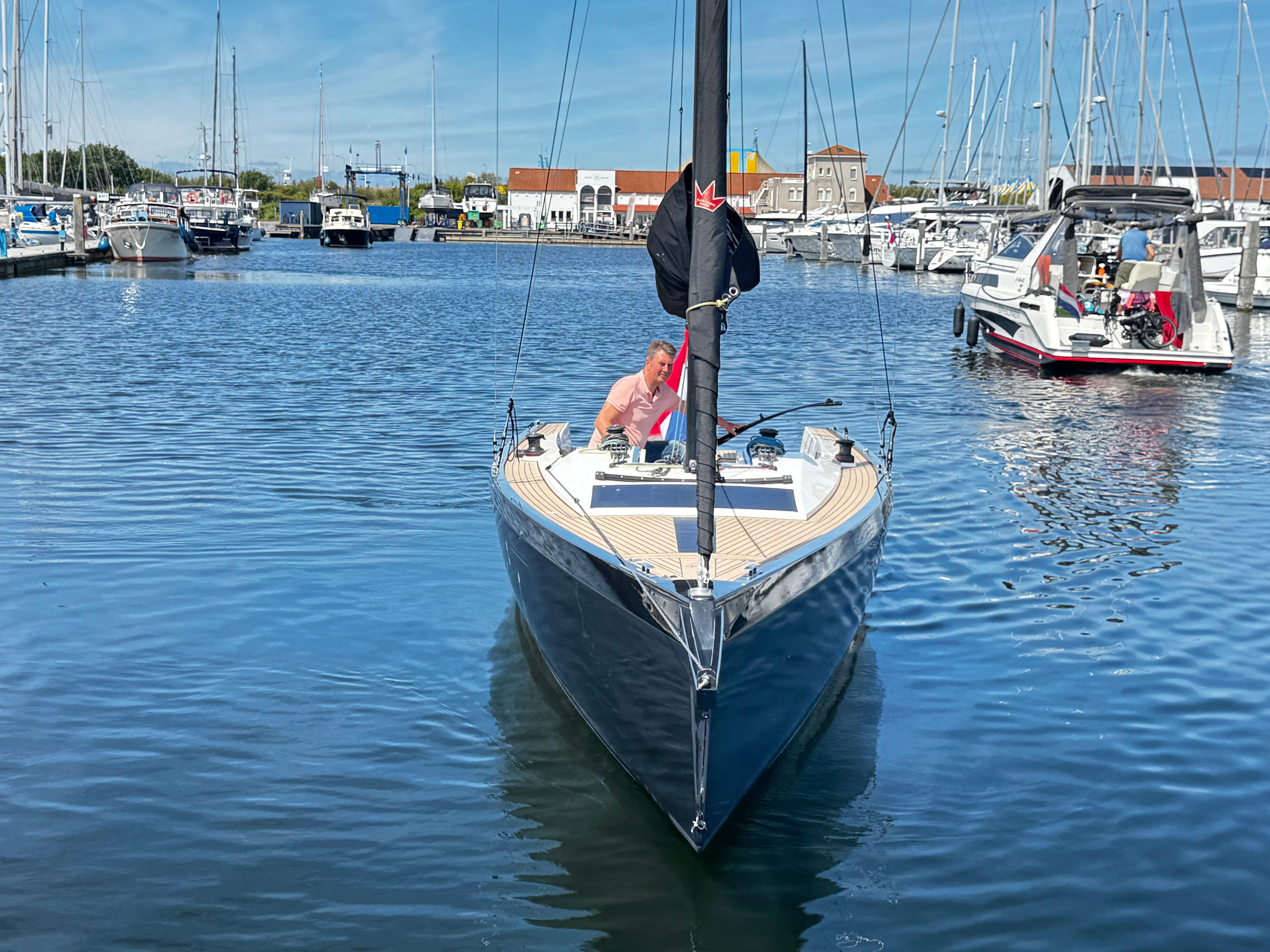 Saffier SE 24 Lite sailboat in marina, 2023 model, with person onboard.