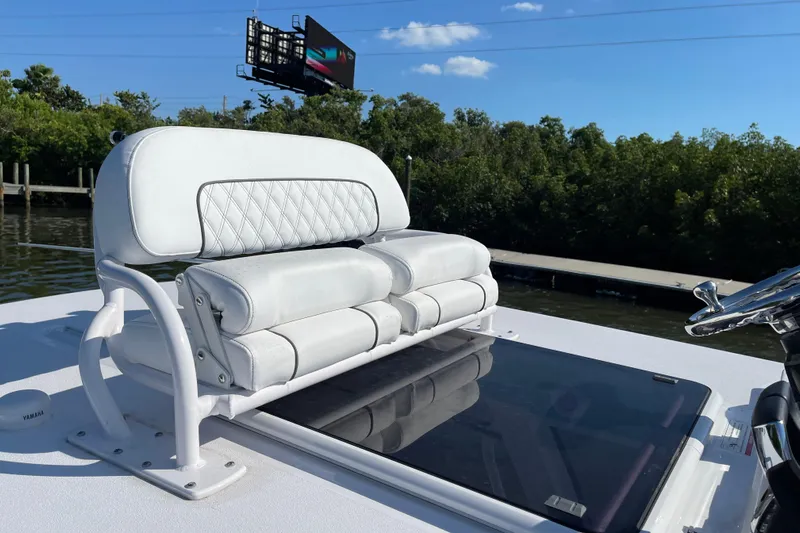  Yacht Photos Pics 2025 Sportsman Open 302 Center Console boat with white cushioned seating.