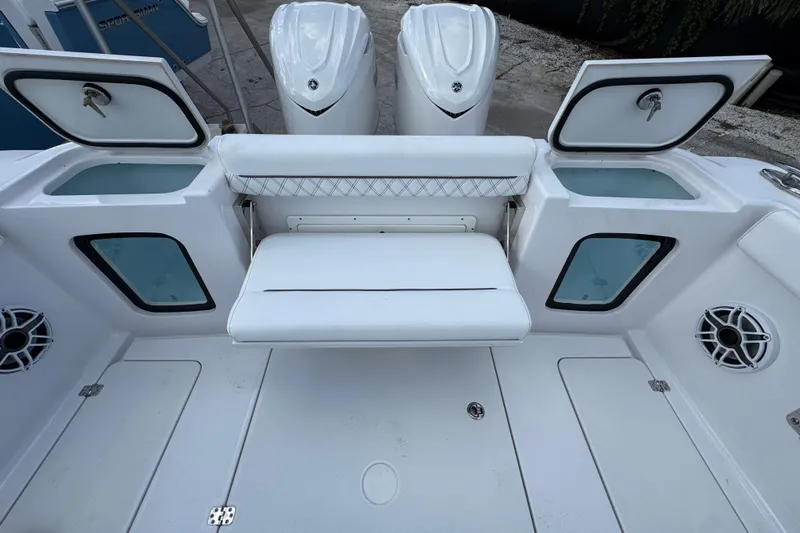  Yacht Photos Pics 2025 Sportsman Open 302 Center Console boat interior with seating and storage compartments.