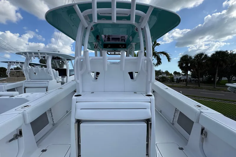  Yacht Photos Pics 2025 Sportsman Open 302 Center Console boat with sleek white seating and modern design.