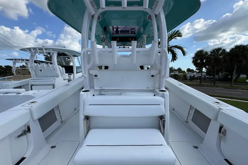 Yacht Photos Pics 2025 Sportsman Open 302 Center Console boat interior with seating and helm station.