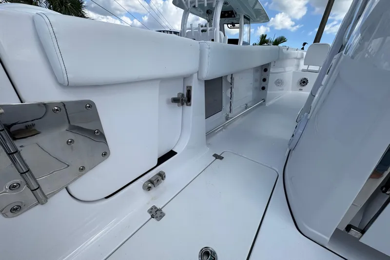 Yacht Photos Pics 2025 Sportsman Open 302 Center Console interior with sleek white seating and stainless steel fixtures.
