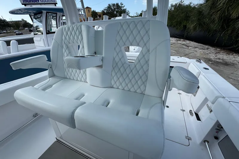  Yacht Photos Pics 2025 Sportsman Open 302 Center Console boat with luxurious seating and armrests.