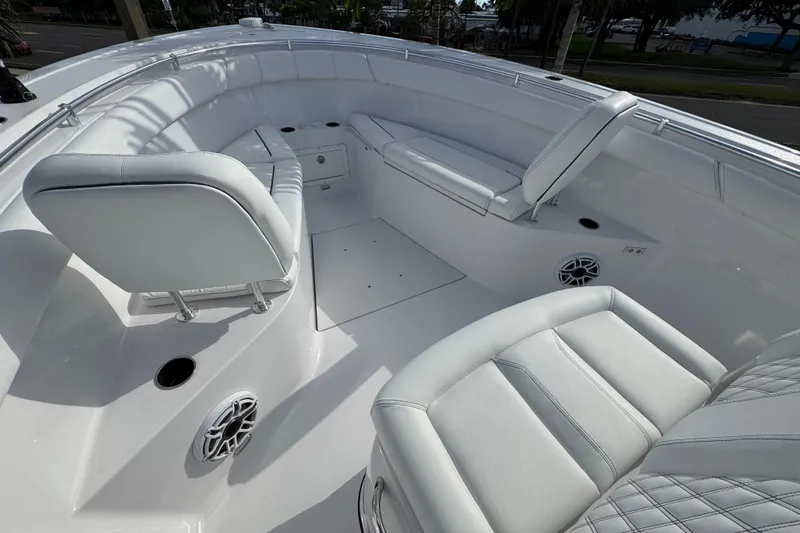  Yacht Photos Pics 2025 Sportsman Open 302 Center Console boat interior with white seating and speakers.
