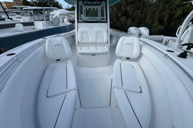  Yacht Photos Pics 2025 Sportsman Open 302 Center Console boat interior with white seating and modern design.