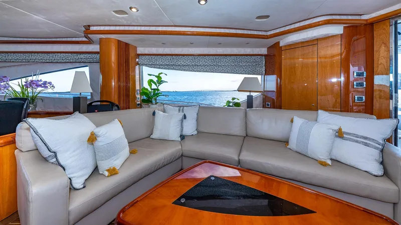Iconic Yacht Photos Pics Luxurious interior of 2003 Sunseeker 82 Yacht with elegant seating and ocean view.