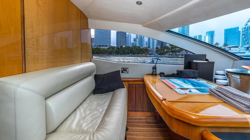 Iconic Yacht Photos Pics Luxurious interior of 2003 Sunseeker 82 Yacht with city skyline view.